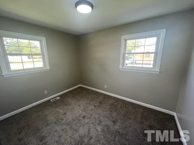 100 Lilly Street Dunn, NC 28334 - Photo 11 of 19 an empty room with a window