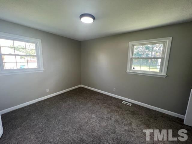 100 Lilly Street Dunn, NC 28334 - Photo 12 of 19 an empty room with a window