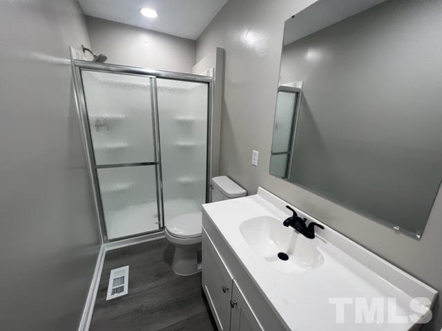 100 Lilly Street Dunn, NC 28334 - Photo 13 of 19 a bathroom with a sink toilet and shower