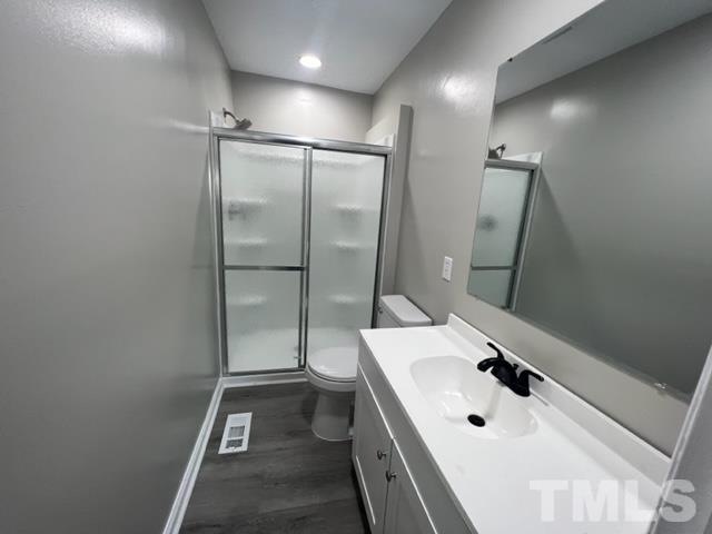 100 Lilly Street Dunn, NC 28334 - Photo 14 of 19 a bathroom with a sink a toilet and shower
