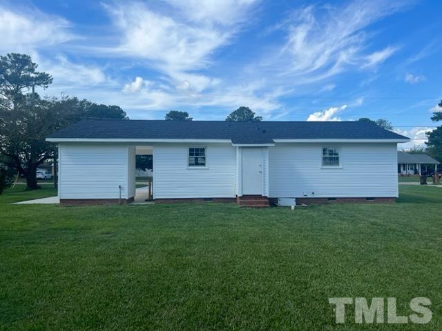 100 Lilly Street Dunn, NC 28334 - Photo 17 of 19 a view of a yard with a house