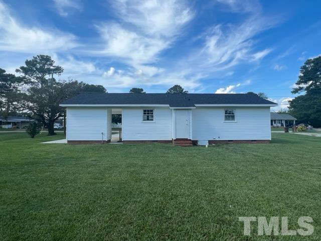 100 Lilly Street Dunn, NC 28334 - Photo 18 of 19 a view of a yard with a house
