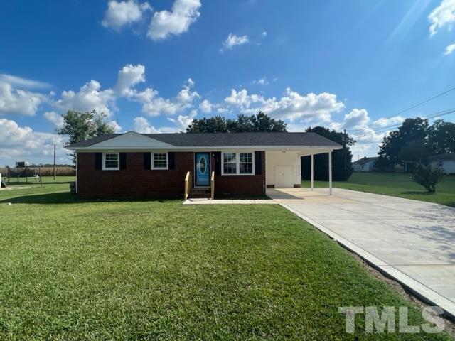 100 Lilly Street Dunn, NC 28334 - Photo 19 of 19 front view of a house with a garden