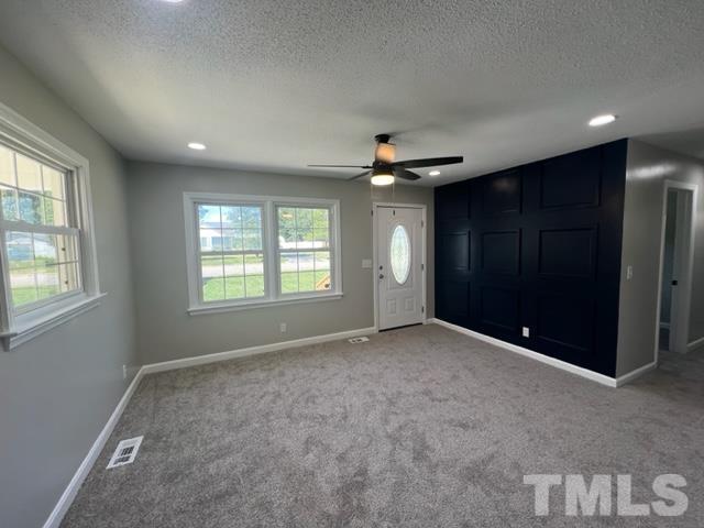 100 Lilly Street Dunn, NC 28334 - Photo 5 of 19 a view of an empty room with a window
