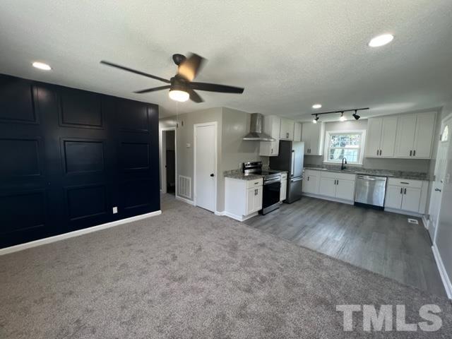 100 Lilly Street Dunn, NC 28334 - Photo 6 of 19 a view of a kitchen with a sink and stainless steel appliances