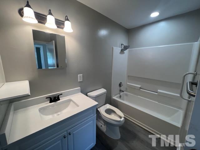 100 Lilly Street Dunn, NC 28334 - Photo 8 of 19 a bathroom with a sink a toilet and shower