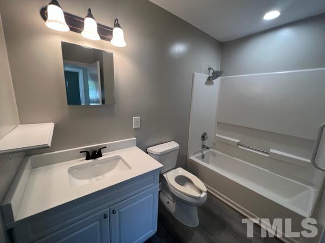 100 Lilly Street Dunn, NC 28334 - Photo 10 of 19 a bathroom with a sink a toilet and shower