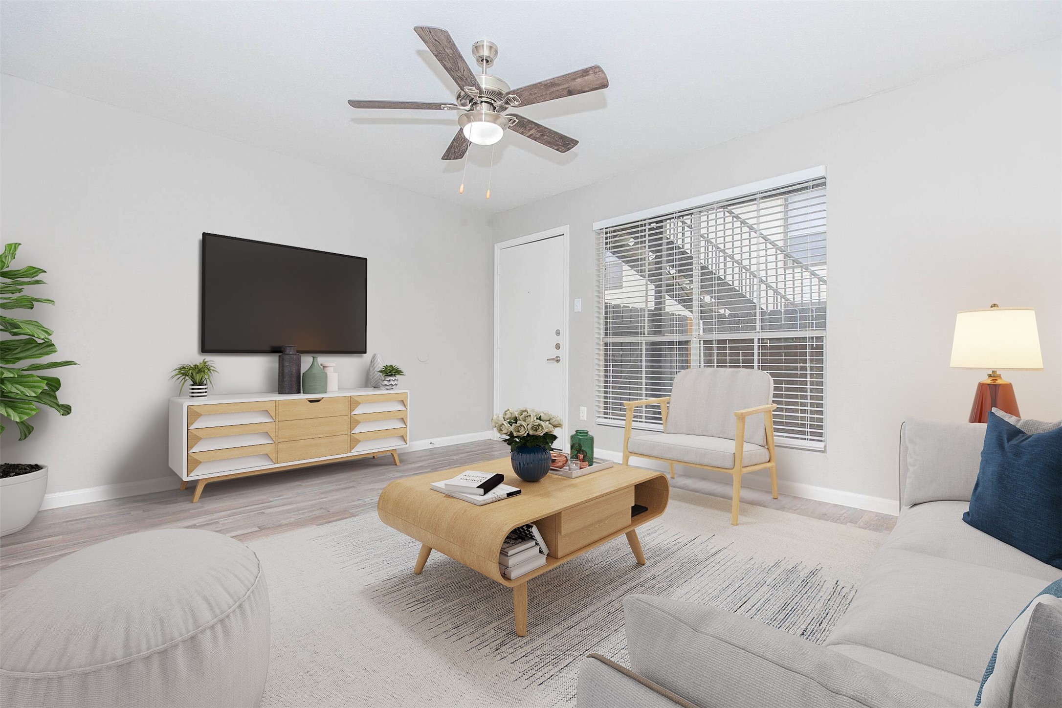 a living room with furniture and a flat screen tv