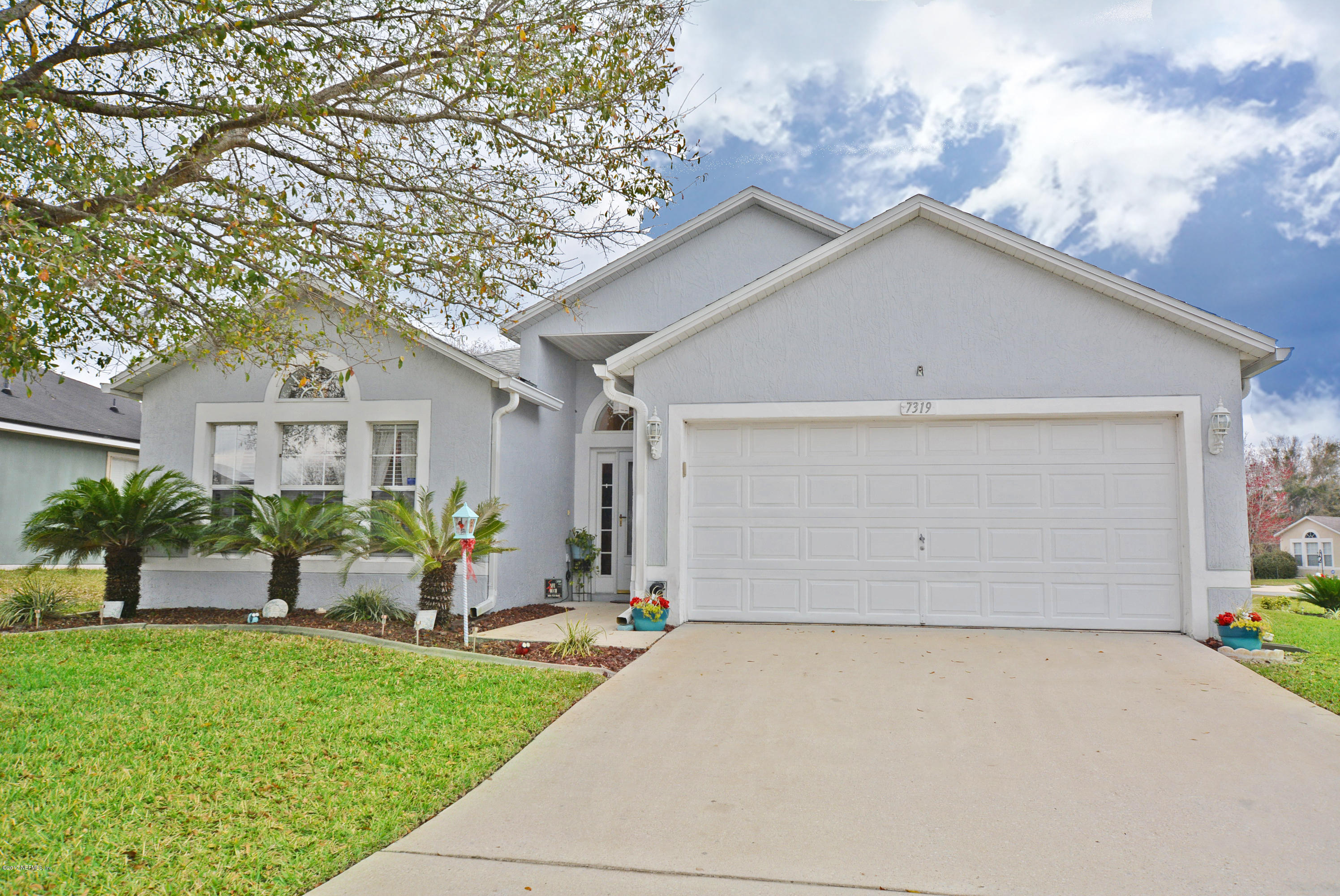 7319 Gum Tree Road Jacksonville, FL 32244 - Photo 1 of 41 a front view of house with yard and green space