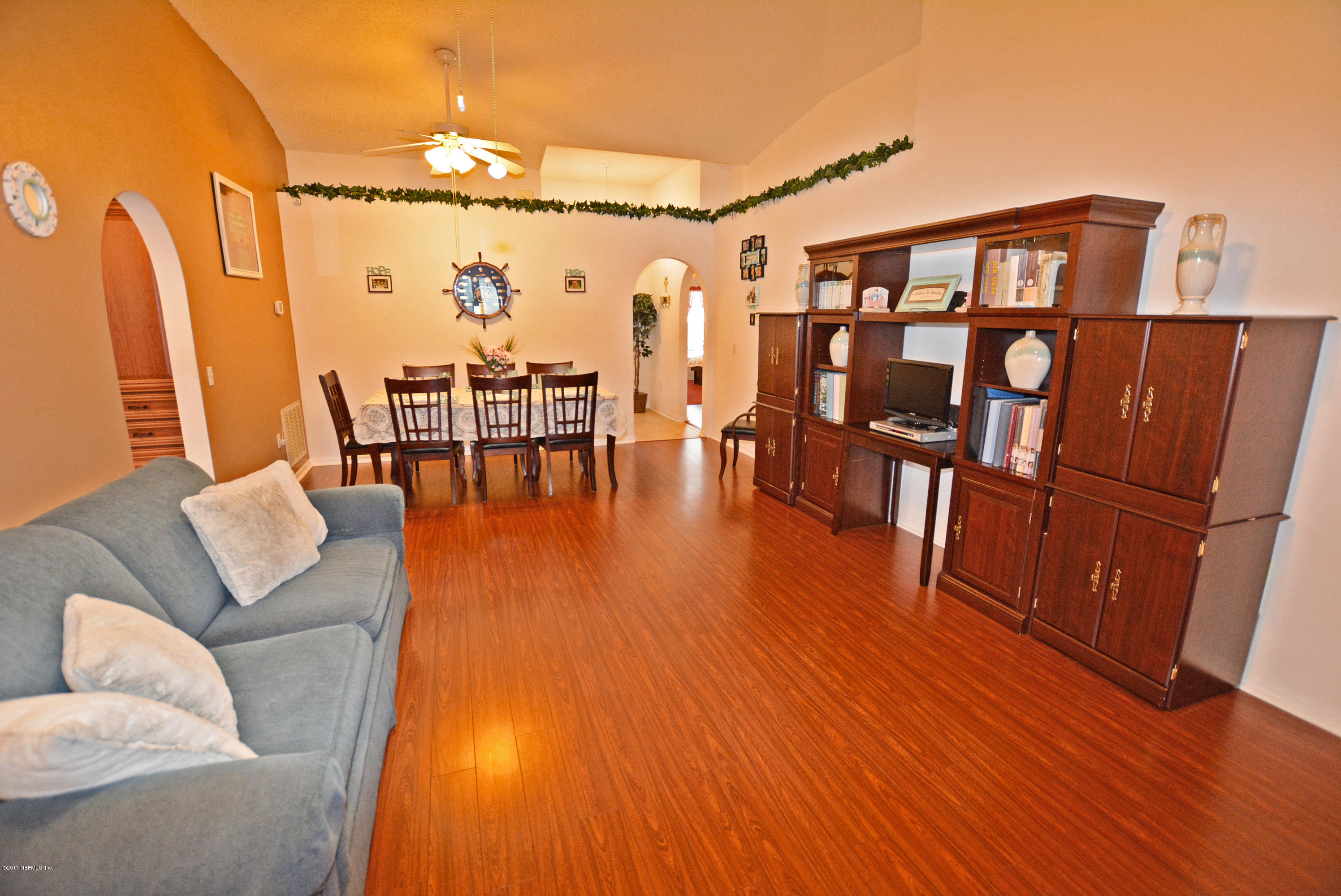 7319 Gum Tree Road Jacksonville, FL 32244 - Photo 11 of 41 a living room with furniture and wooden floor