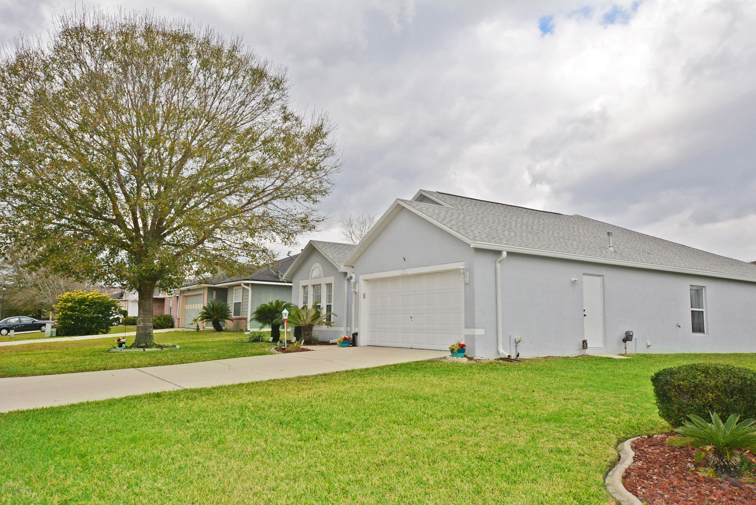 7319 Gum Tree Road Jacksonville, FL 32244 - Photo 2 of 41 a front view of house with yard and green space