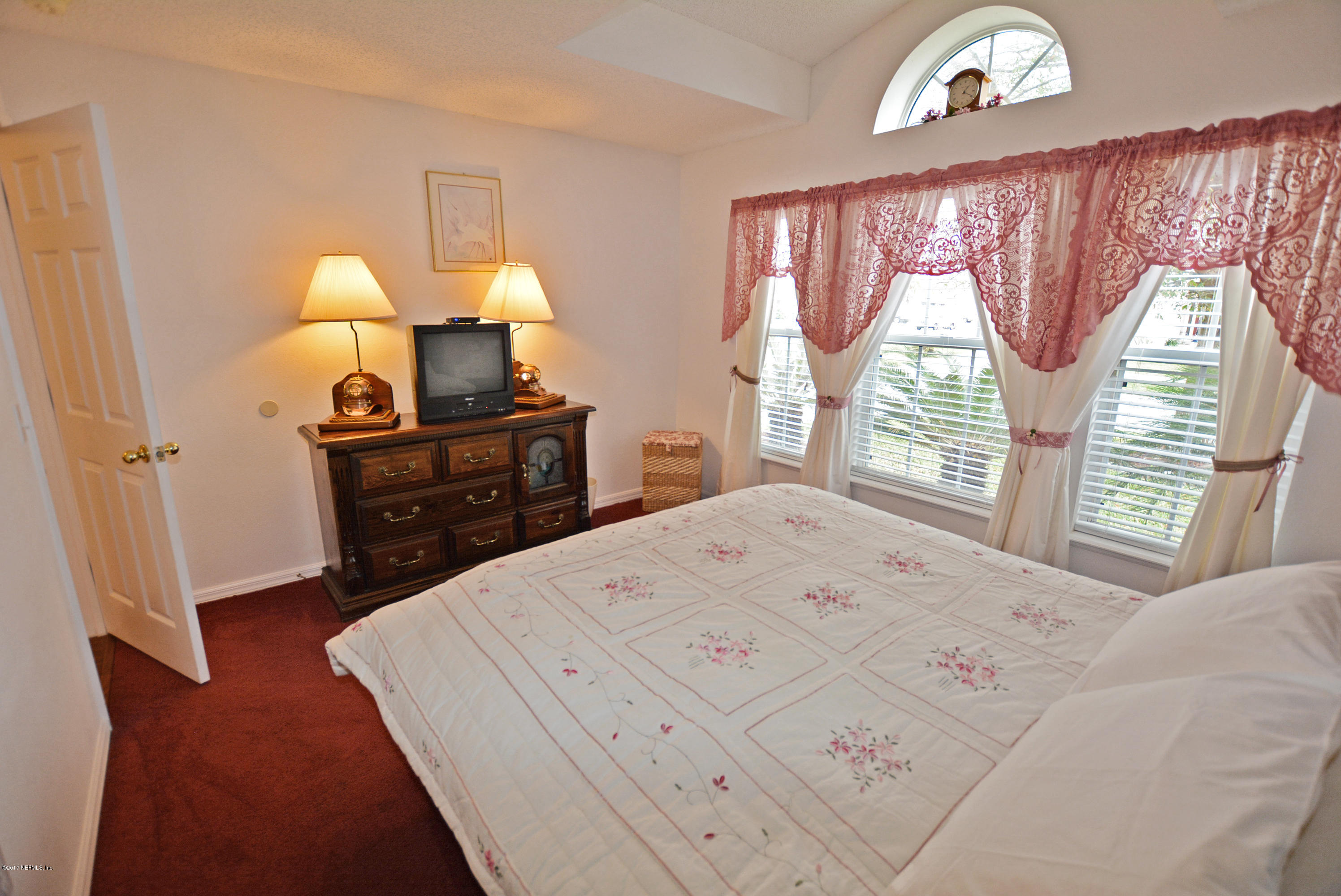 7319 Gum Tree Road Jacksonville, FL 32244 - Photo 33 of 41 a bedroom with a bed and a window