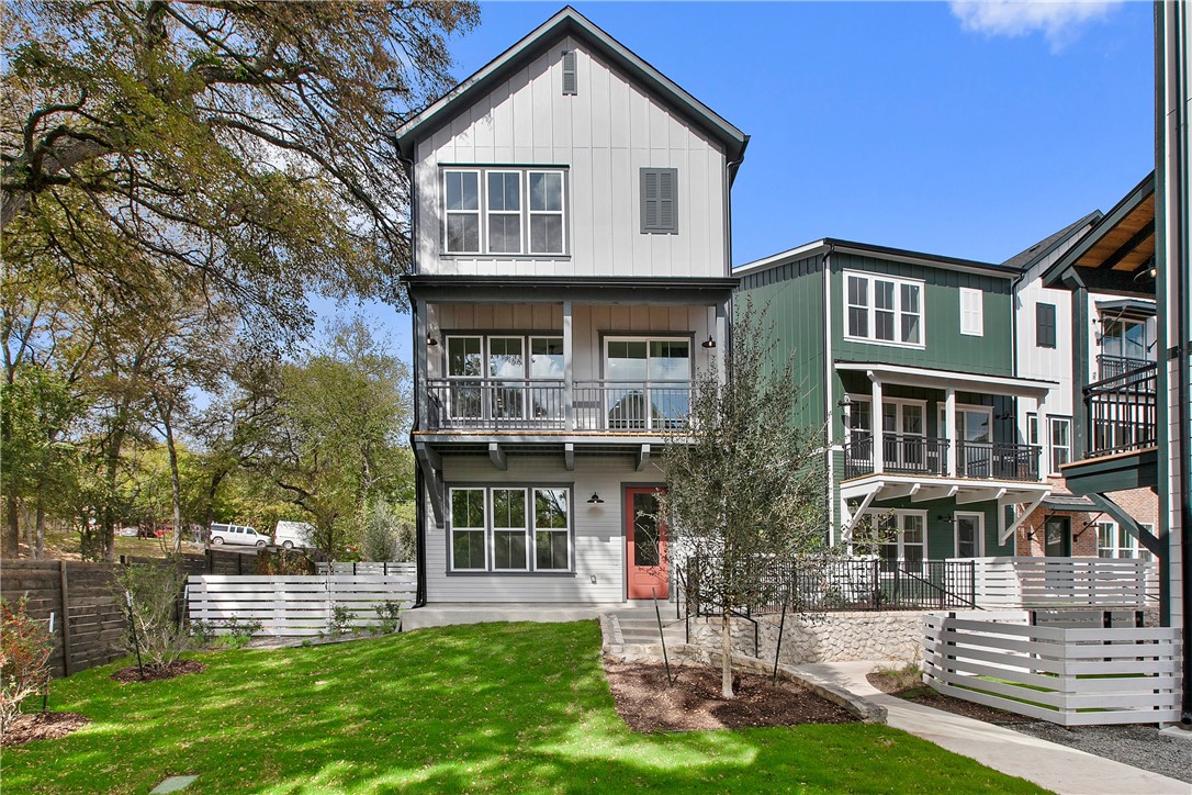 a front view of a house with a yard table and chairs