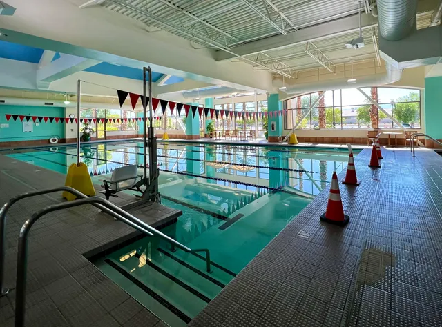 a view of a swimming pool with a patio