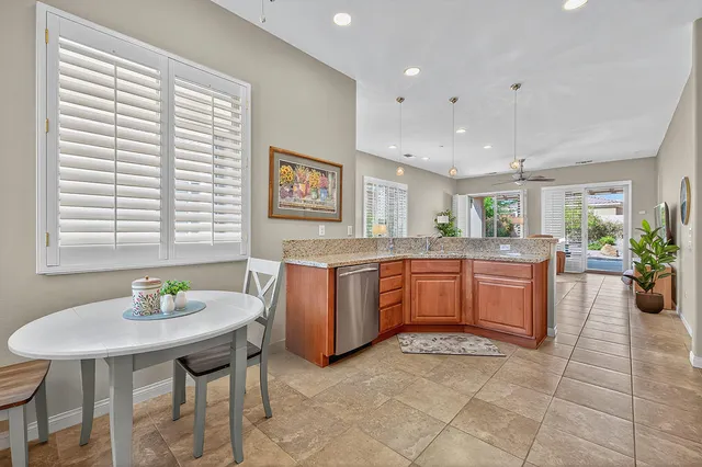 a kitchen with a table and chairs in it