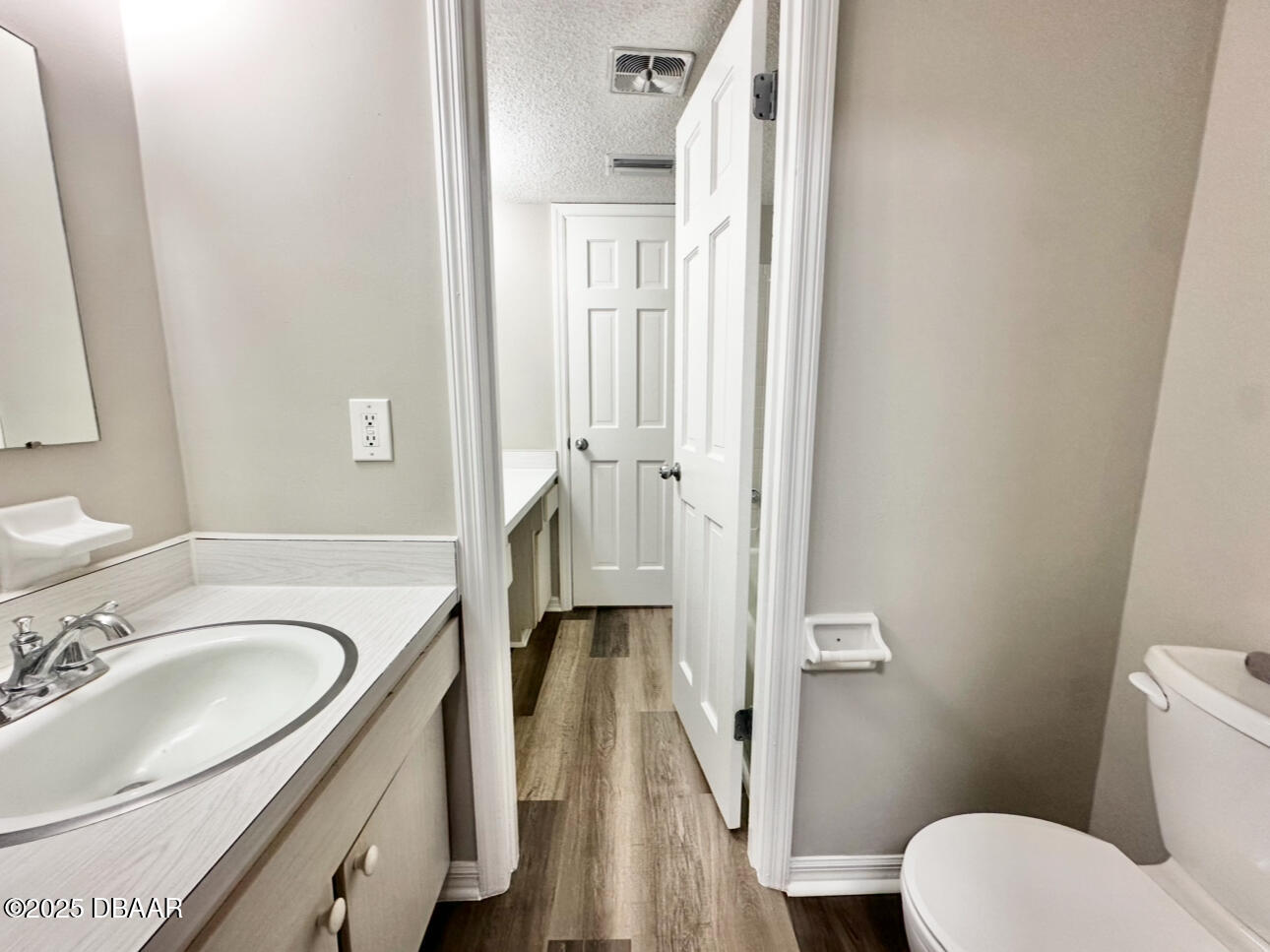 2250 South Palmetto Avenue, Unit J3 South Daytona, FL 32119 - Photo 12 of 20 a bathroom with a sink a toilet and a mirror