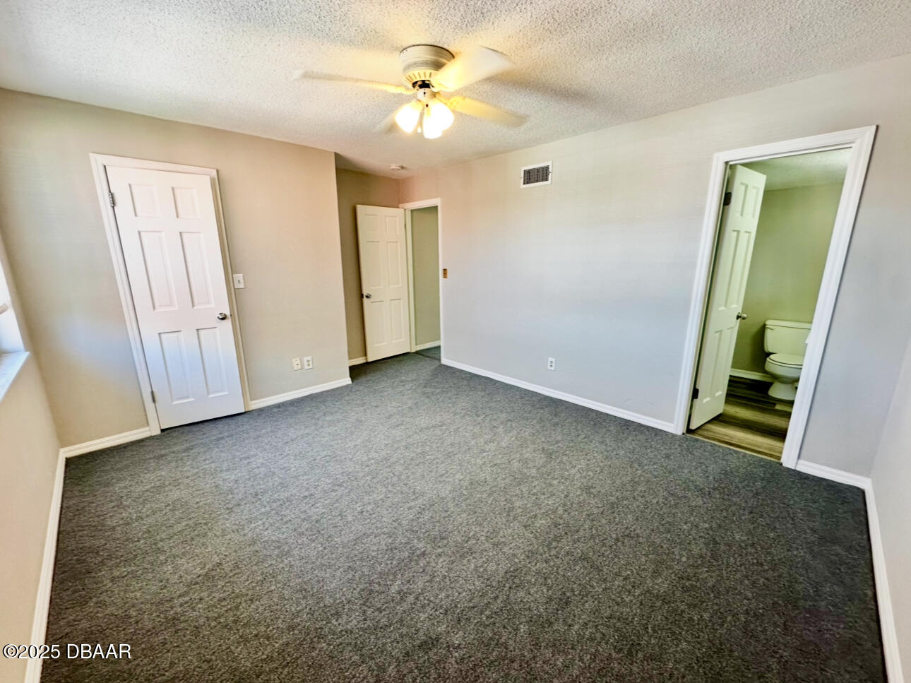 2250 South Palmetto Avenue, Unit J3 South Daytona, FL 32119 - Photo 17 of 20 an empty room with closet and fan