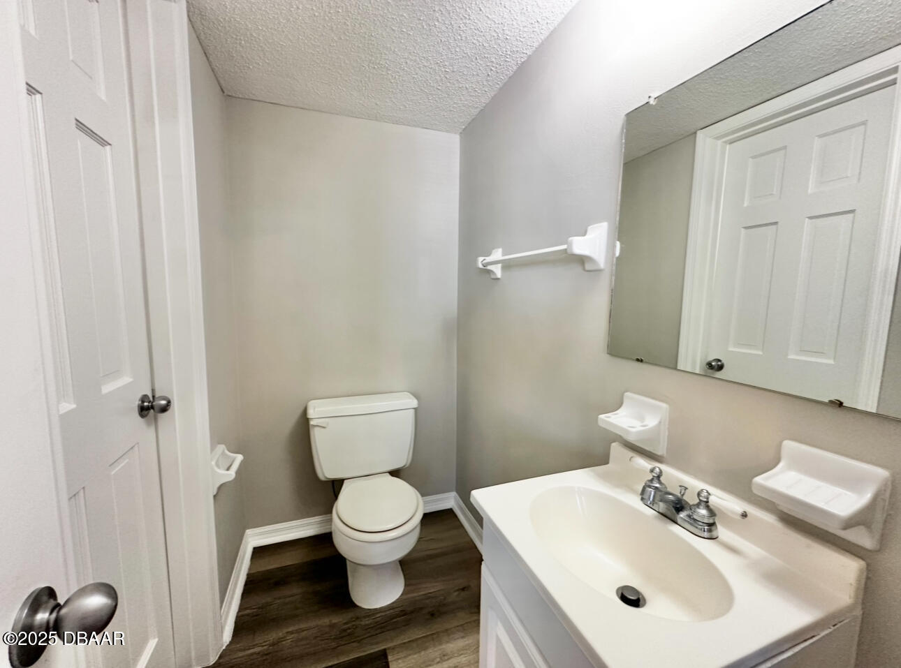 2250 South Palmetto Avenue, Unit J3 South Daytona, FL 32119 - Photo 18 of 20 a bathroom with a sink toilet and a mirror