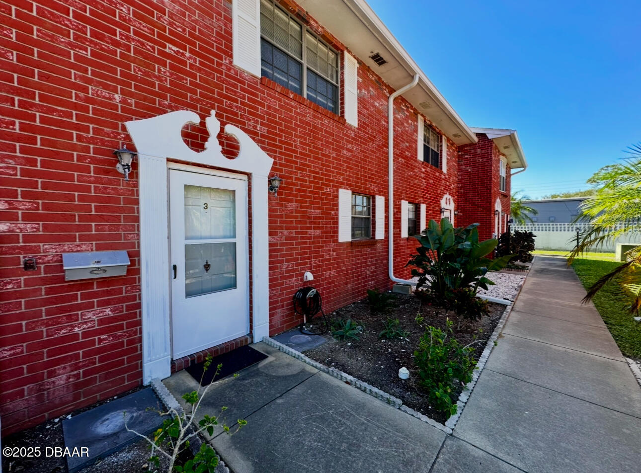 2250 South Palmetto Avenue, Unit J3 South Daytona, FL 32119 - Photo 20 of 20 a front view of a house with garden