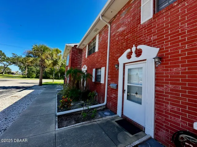 a brick building with a large windows