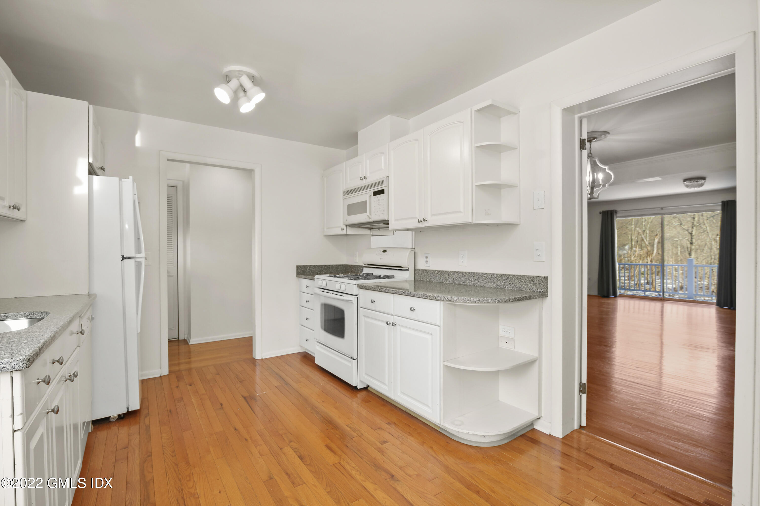 88 Silo Circle, Unit 88 Riverside, CT 06878 - Photo 5 of 20 a kitchen with stainless steel appliances a refrigerator sink and cabinets