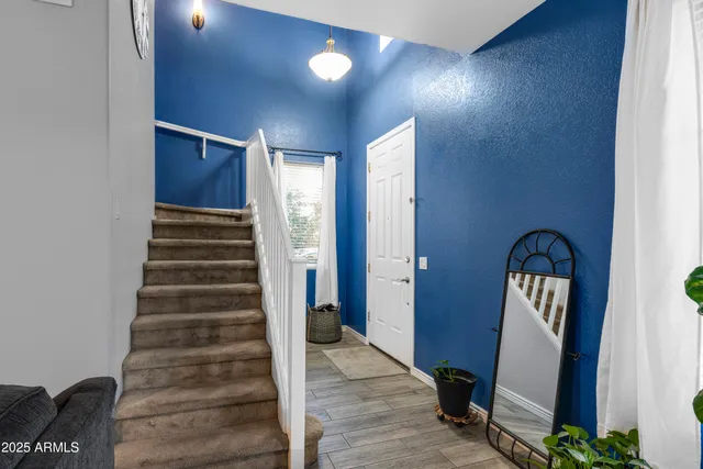 a view of front door with stairs