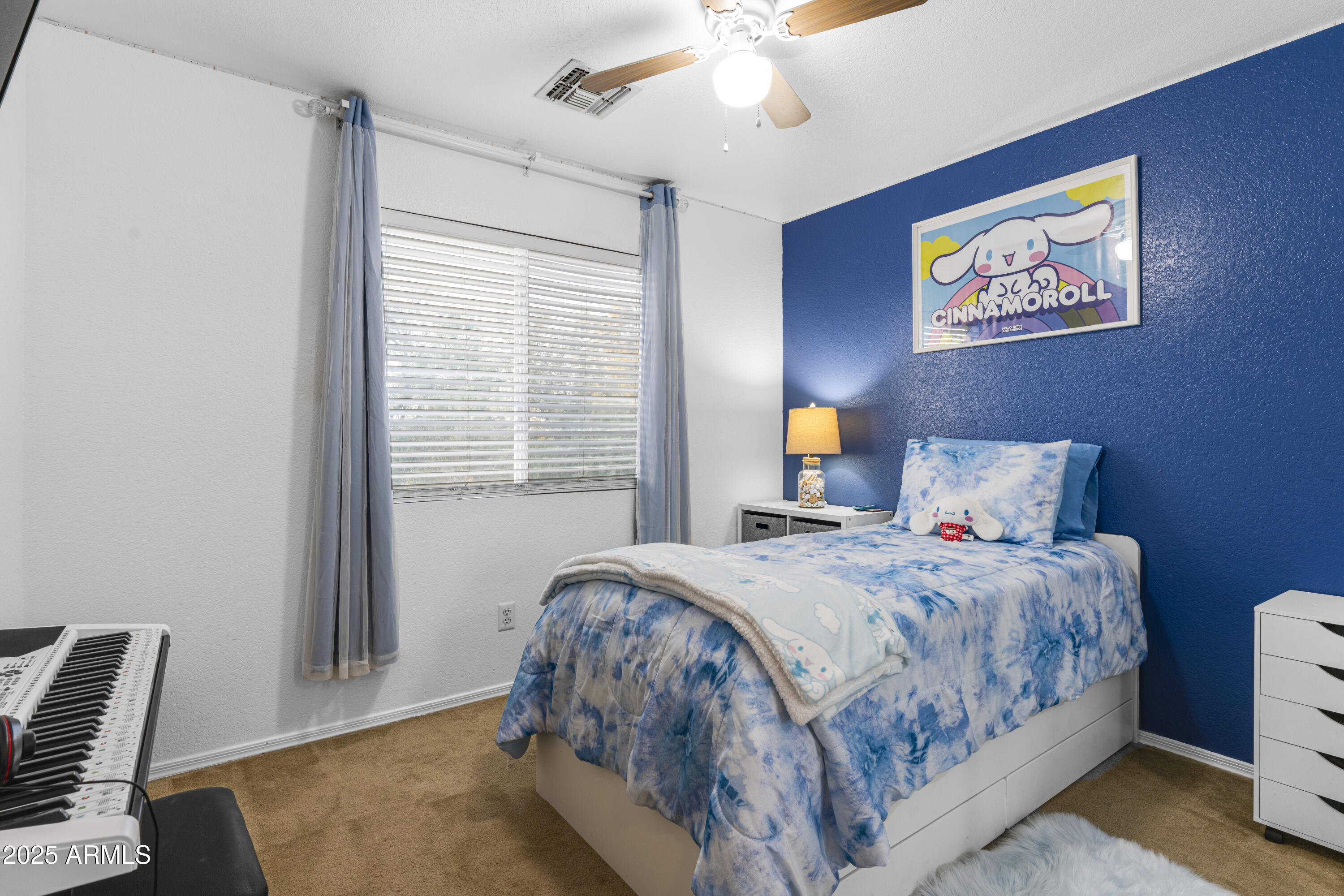 1512 East Chipman Road Phoenix, AZ 85040 - Photo 14 of 21 a bedroom with a bed and a window