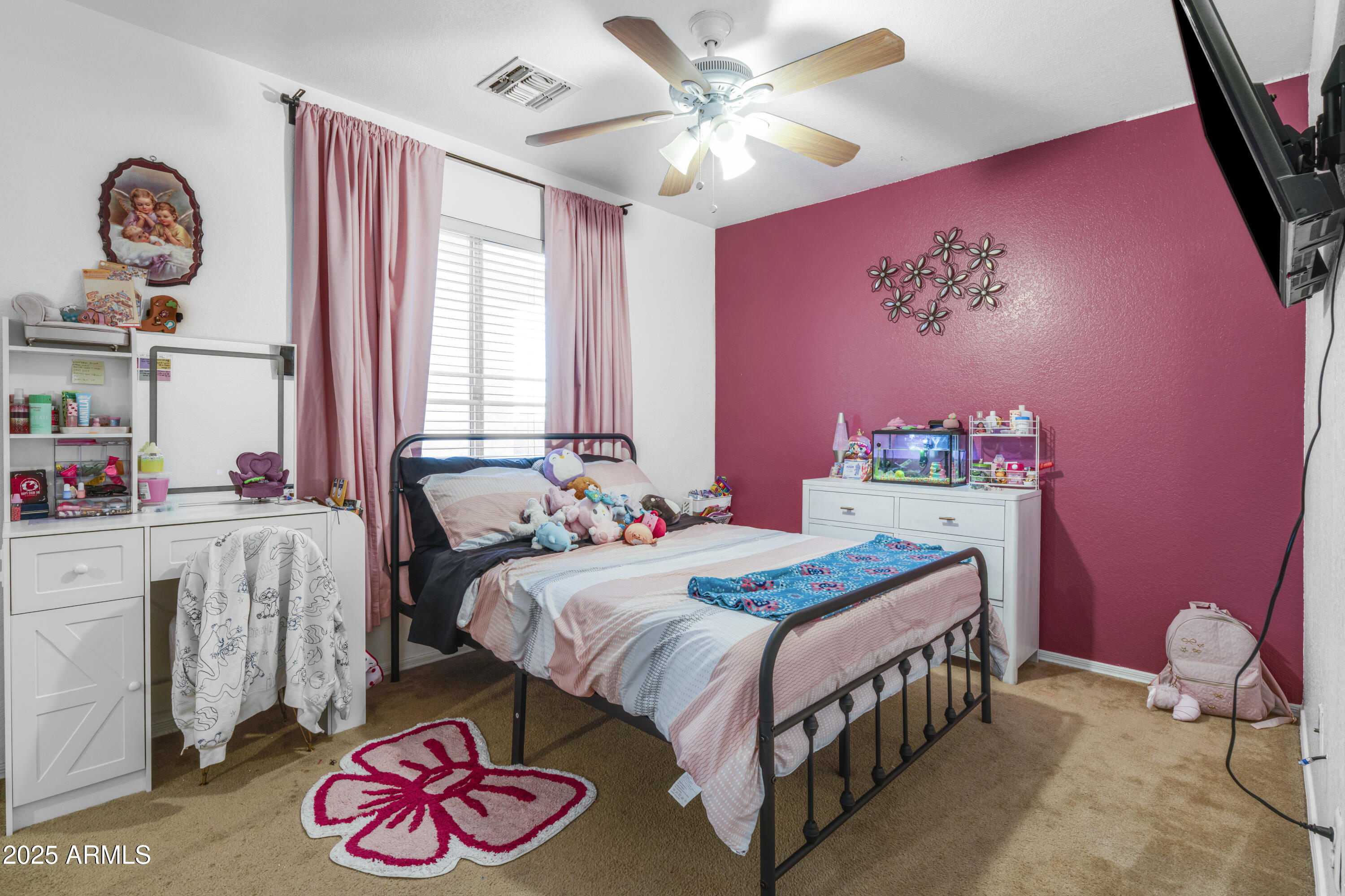 1512 East Chipman Road Phoenix, AZ 85040 - Photo 15 of 21 a bedroom with a bed and a chandelier