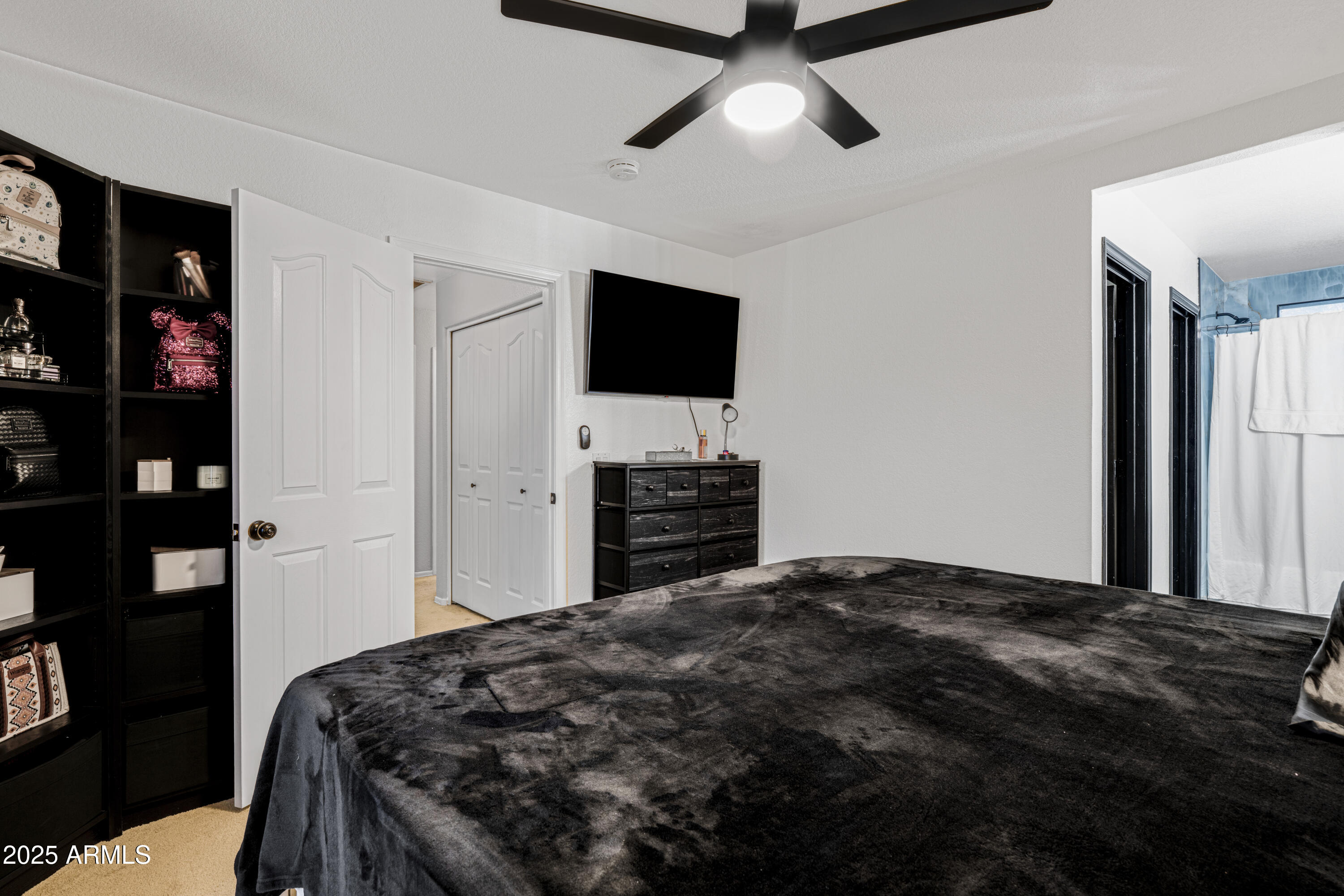 1512 East Chipman Road Phoenix, AZ 85040 - Photo 19 of 21 a bedroom with a bed and a flat screen tv