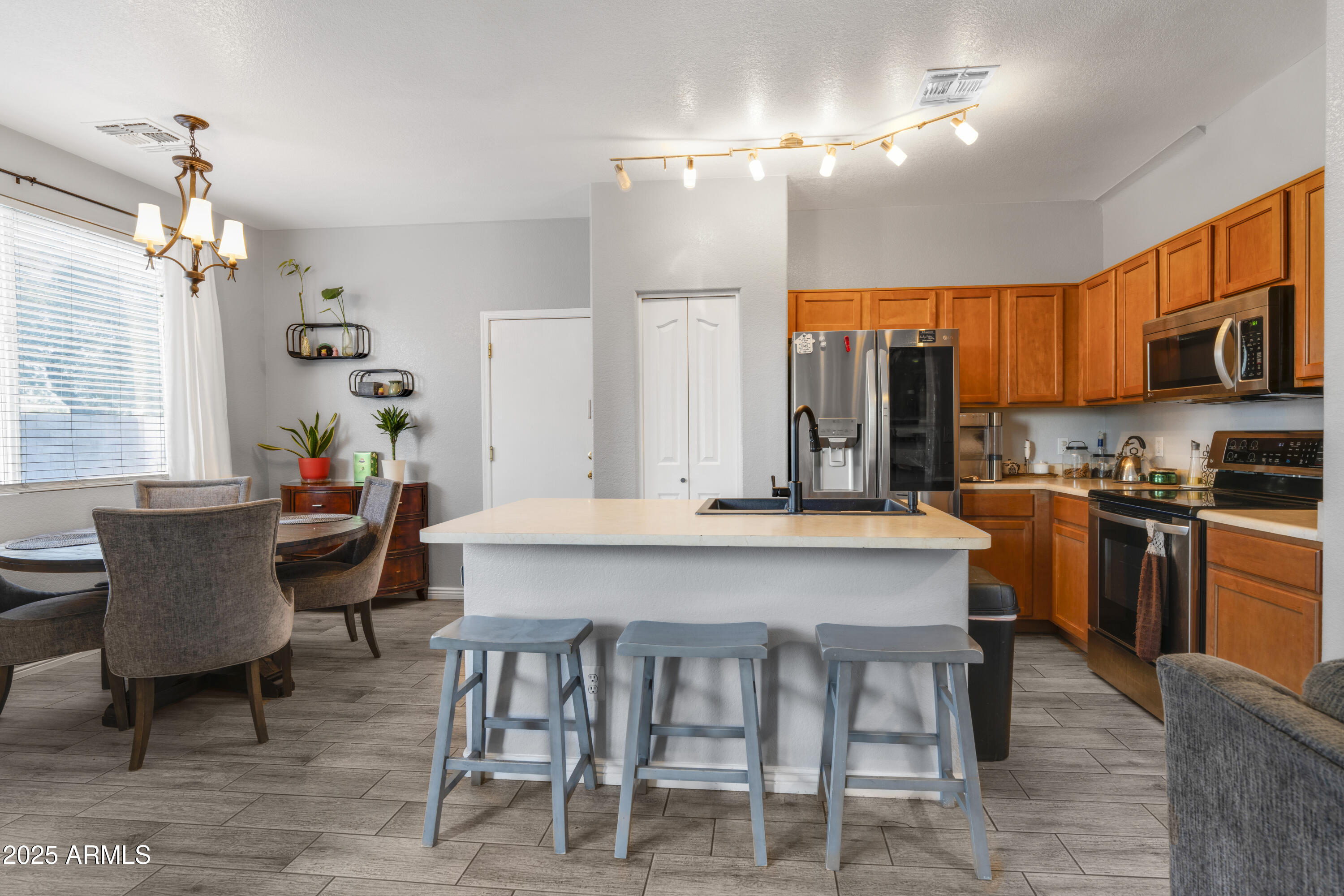 1512 East Chipman Road Phoenix, AZ 85040 - Photo 5 of 21 a large kitchen with a table and chairs