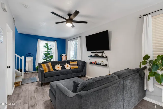 a living room with furniture and a flat screen tv