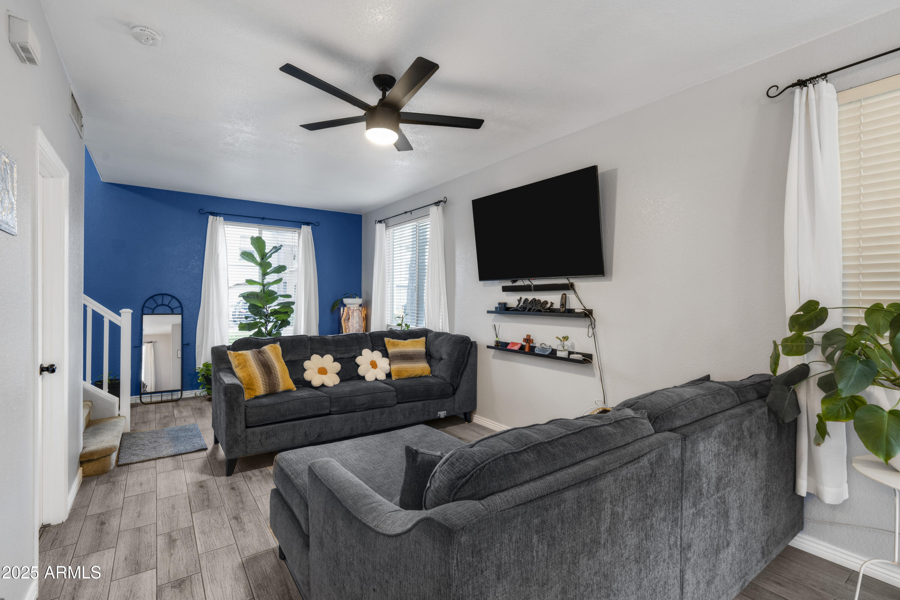 1512 East Chipman Road Phoenix, AZ 85040 - Photo 9 of 21 a living room with furniture and a flat screen tv