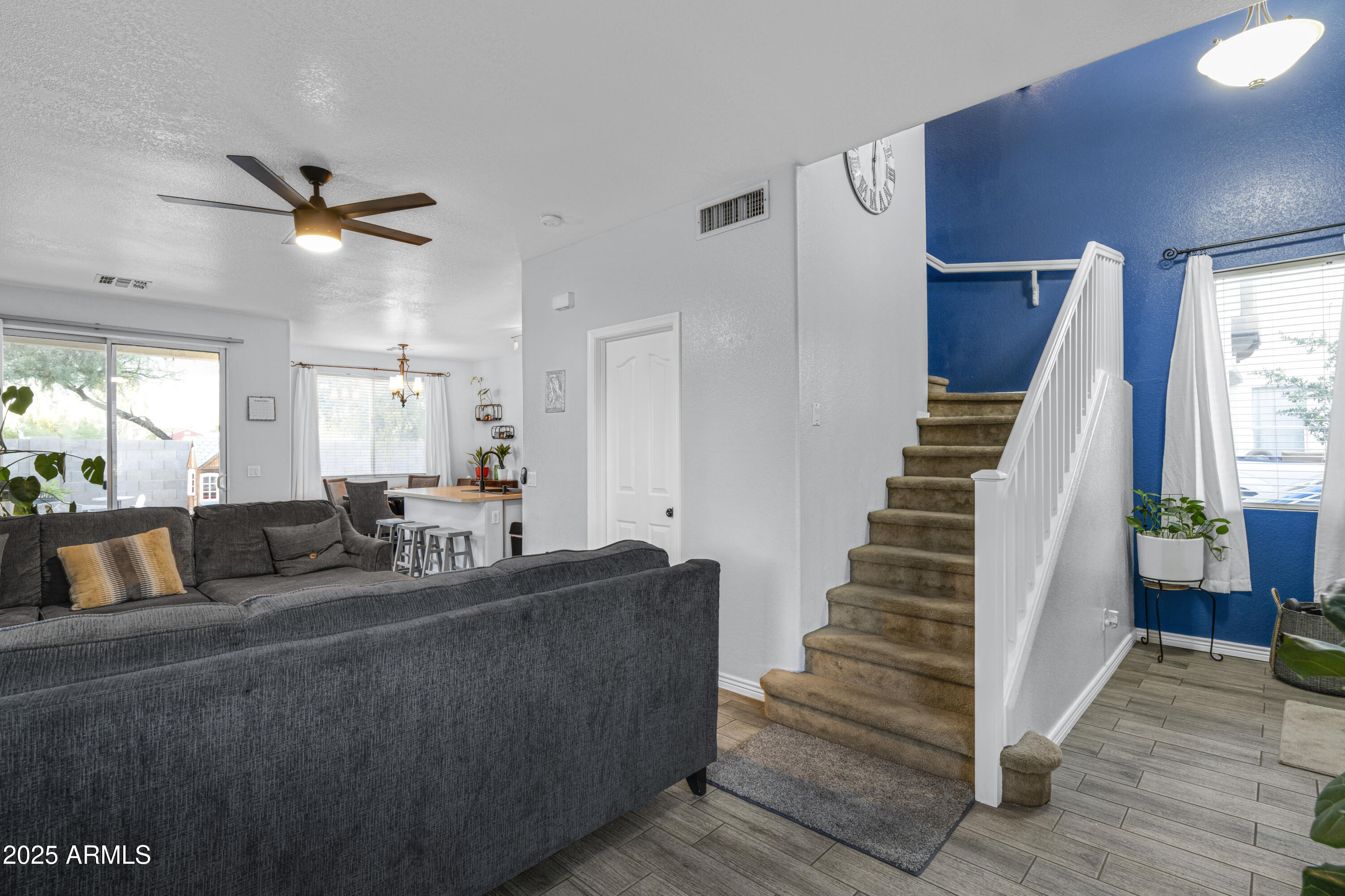 1512 East Chipman Road Phoenix, AZ 85040 - Photo 10 of 21 a living room with furniture and wooden floor