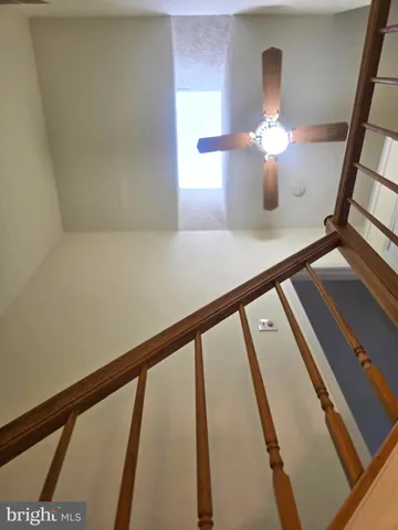 a white toilet sitting next to a bath tub and a shower