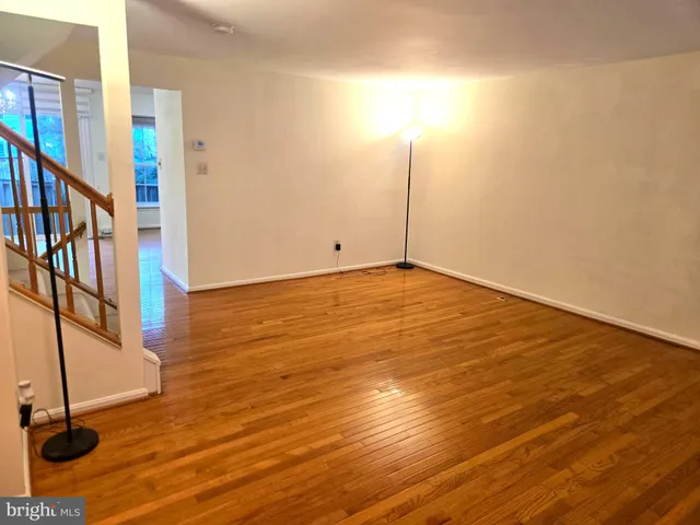 a view of an empty room with stairs