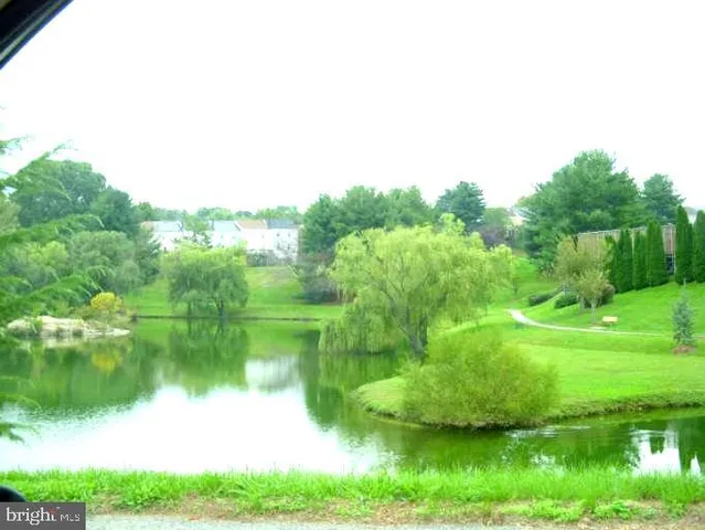 a view of outdoor space with a lake view