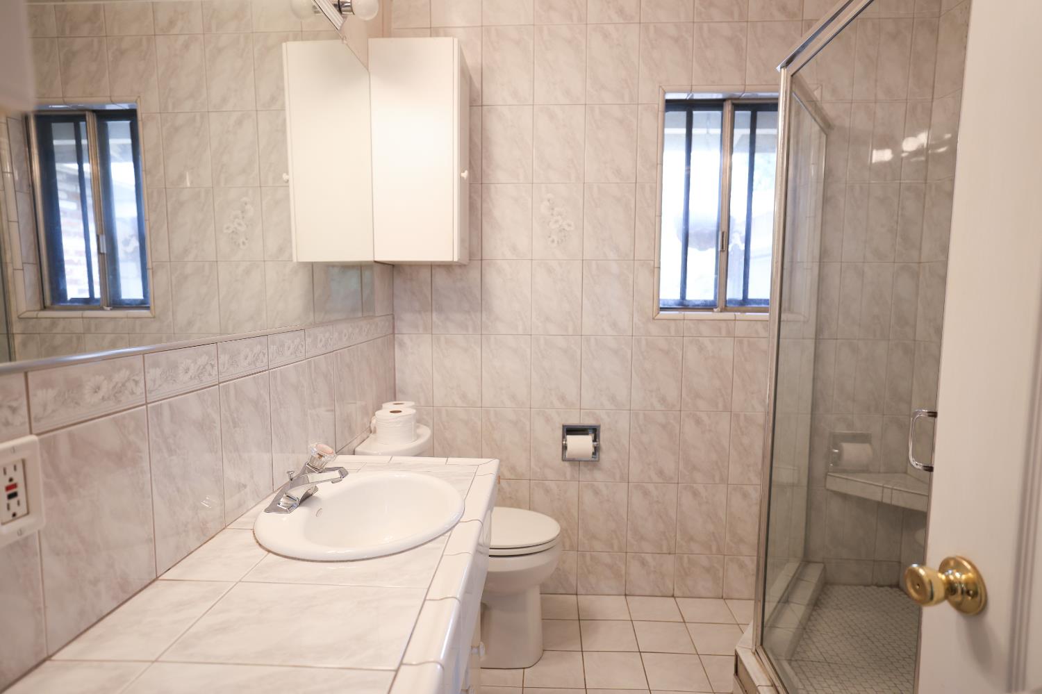 805 B Street Davis, CA 95616 - Photo 14 of 17 a bathroom with a sink toilet and shower