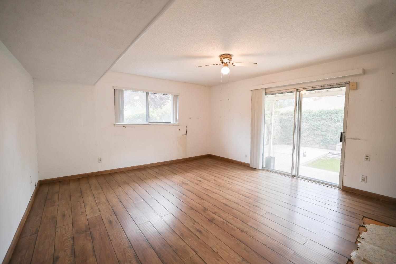 805 B Street Davis, CA 95616 - Photo 15 of 17 an empty room with wooden floor and windows