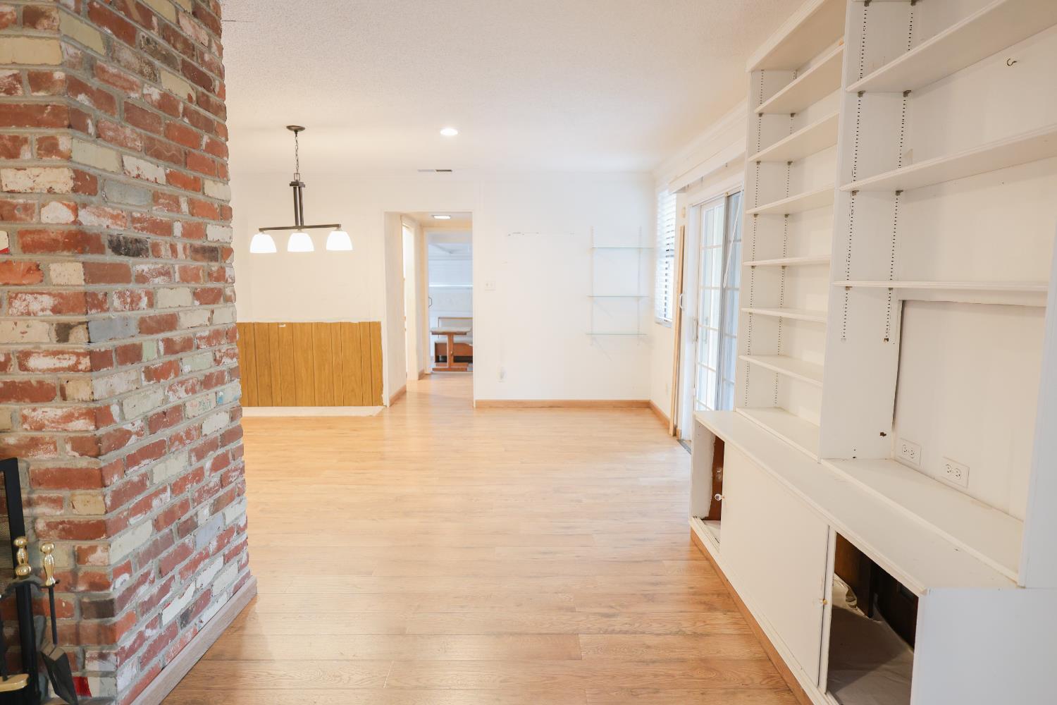 805 B Street Davis, CA 95616 - Photo 4 of 17 a view of an empty room with cabinet and a kitchen view