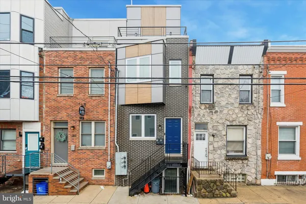 a front view of a building with a lot of windows