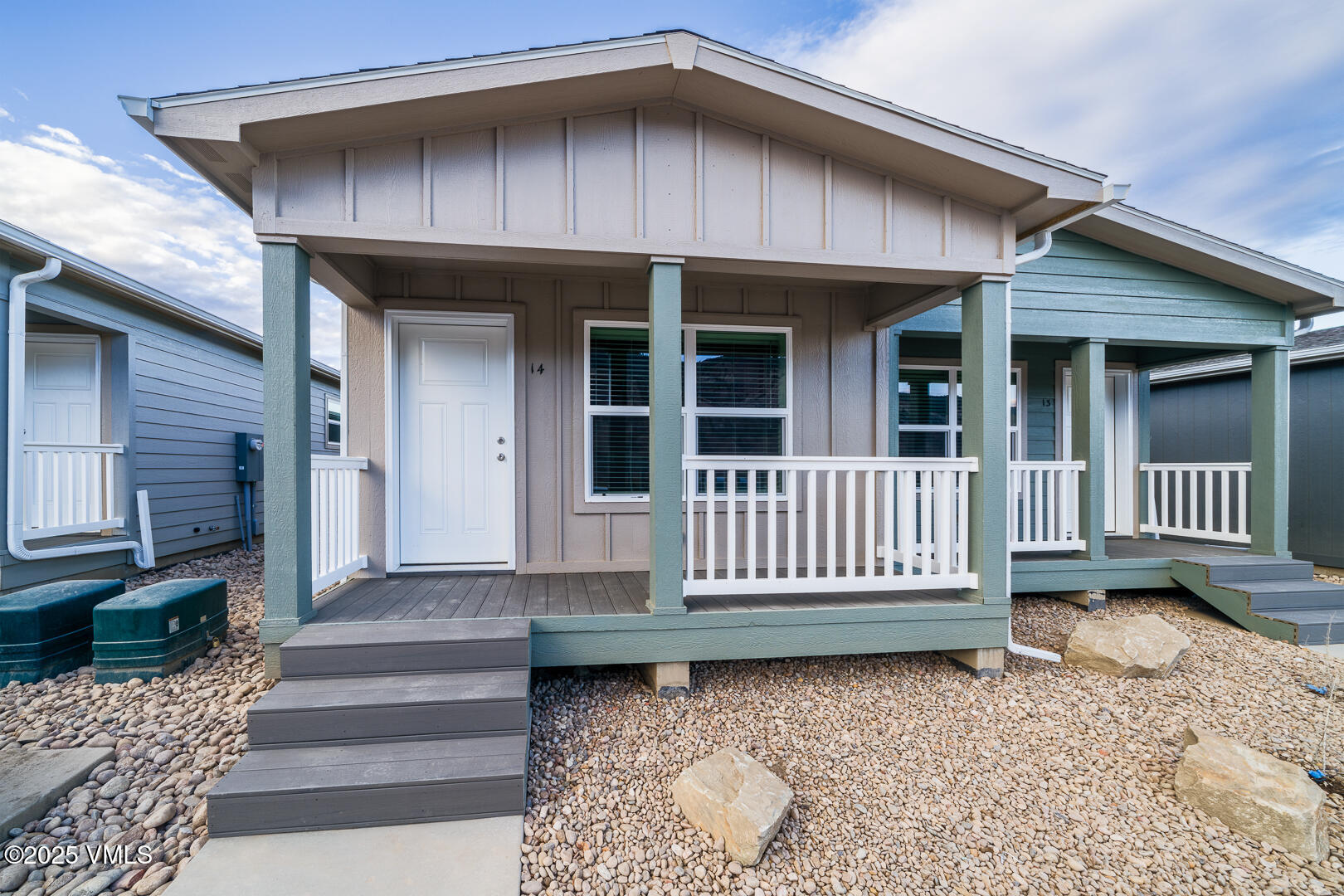 30 Buffalo Circle, Unit 21 Gypsum, CO 81637 - Photo 1 of 16 a front view of a house with a bench