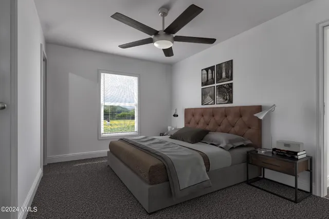 a spacious bedroom with a bed and window