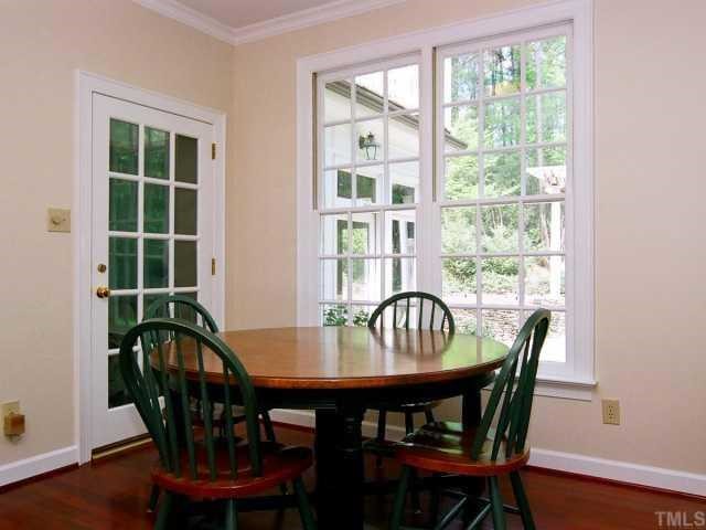 10720 Trego Trail Raleigh, NC 27614 - Photo 8 of 12 The breakfast room is between the kitchen and family room. The French door leads to the sunroom.