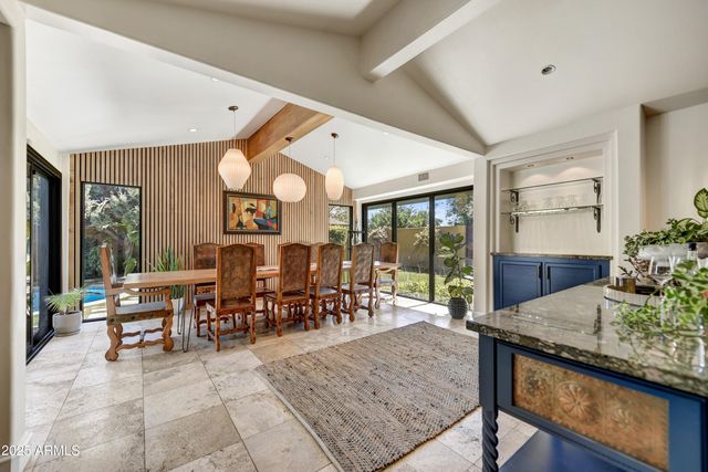 an aerial view of a house with a swimming pool