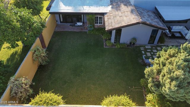 a spacious bedroom with a bed and a table in it