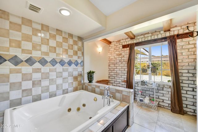 a bathroom with a sink a bathtub and a shower