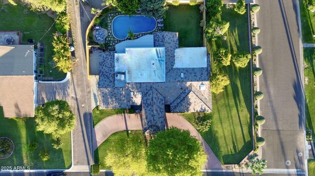 a view of a porch and a yard in back