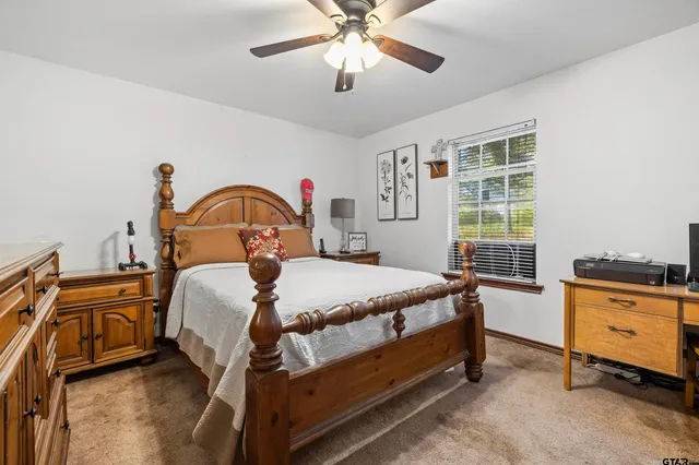 a bed room with a bed and a chandelier