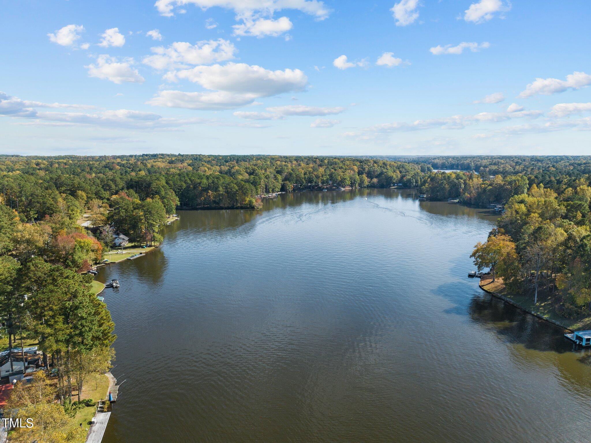 105 Acoma Drive Louisburg, NC 27549 - Photo 1 of 8 a view of a lake with a mountain