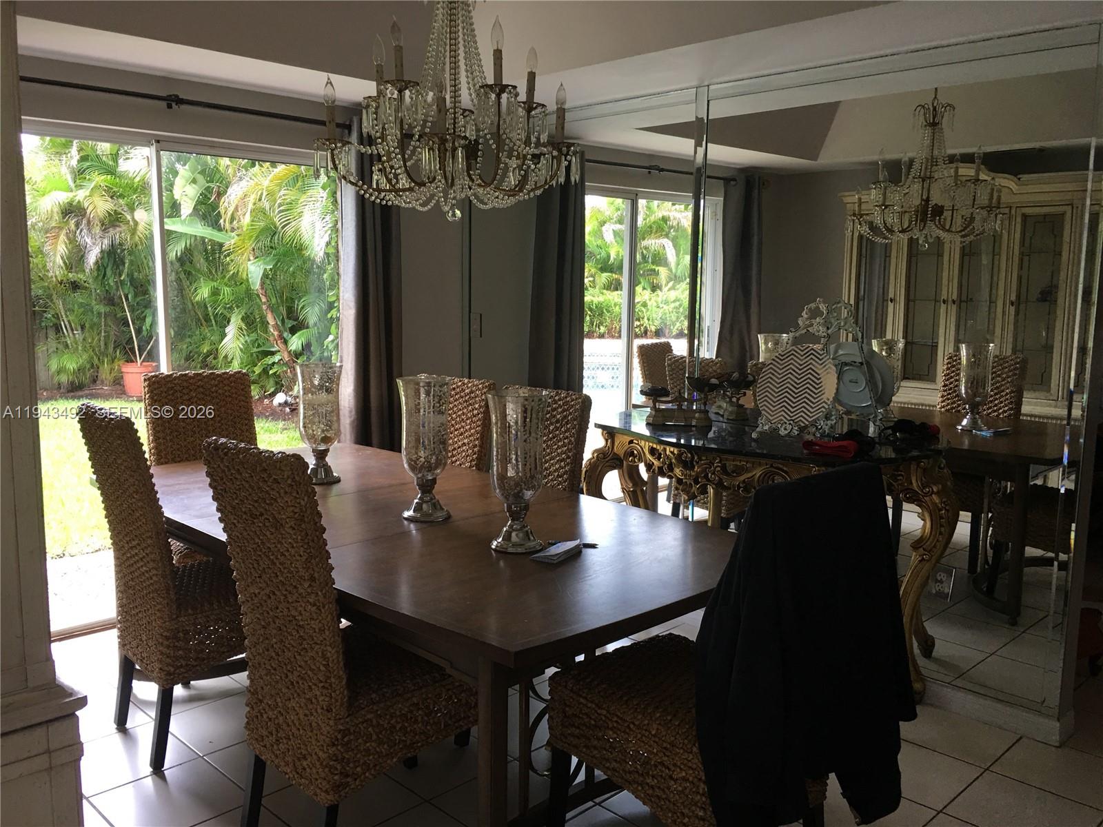 15448 Southwest 92nd Street Miami, FL 33196 - Photo 16 of 36 a view of a dining room with furniture window and outside view